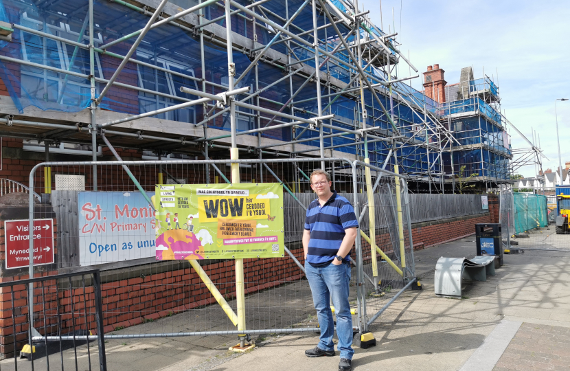 Joel James outside St. Monica's Church-in-Wales Primary School