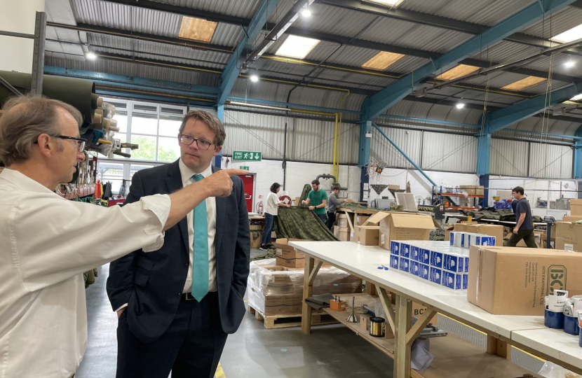 Joel James listening to Andrew Howell MBE on production floor 