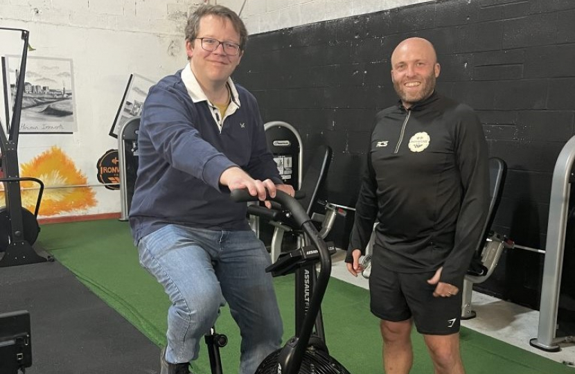 Joel James on exercise bike