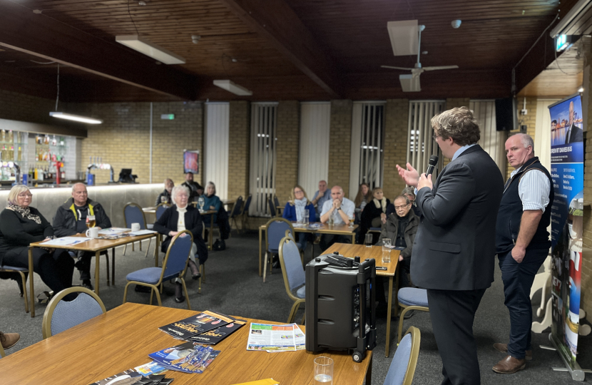 Joel speaking with residents, along with Andrew RT Davies MS, at the Fairwater Club in Cardiff