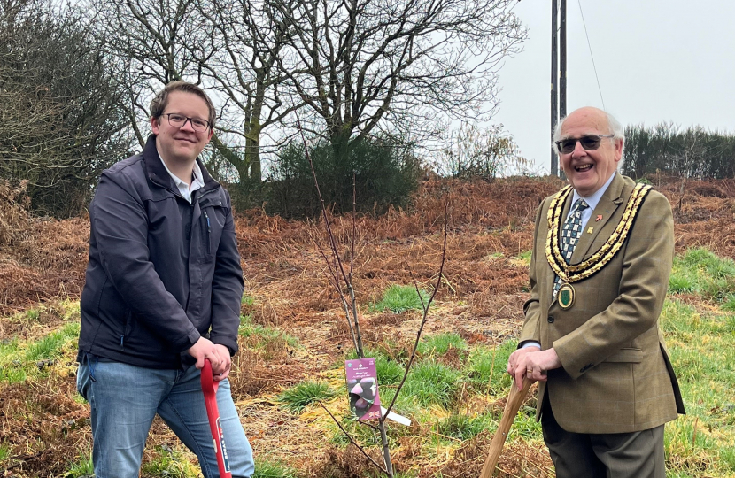 Joel James with Cllr David Stone planting a plum tree at Tir Y Craig - Tonteg