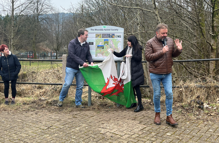 Joel James, Buffy Williams and Martin Roberts unveiling Rhondda Tunnel Society information board 