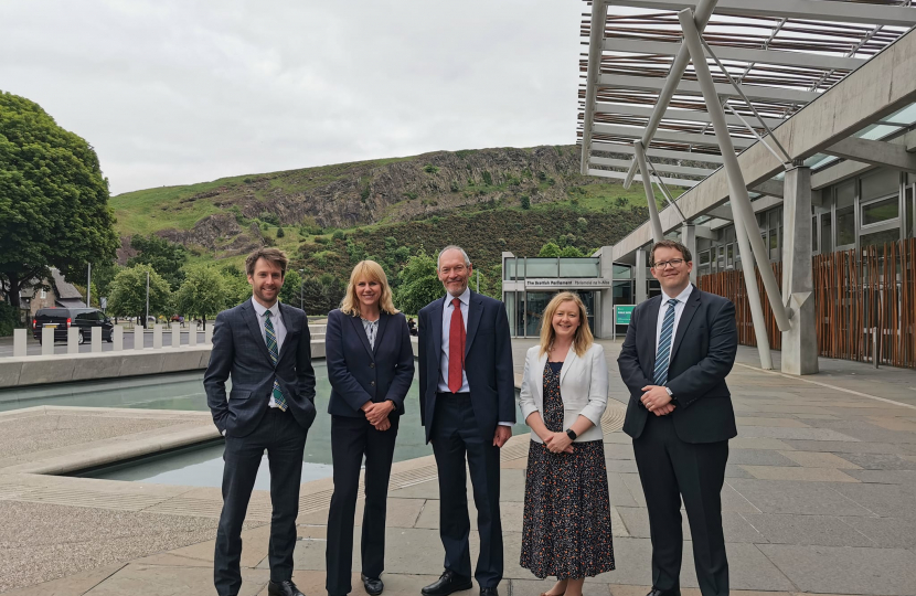 Joel James with Local Government and Housing Committee Members in Holyrood