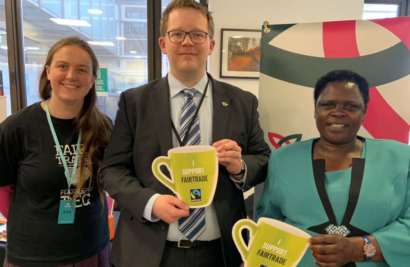 Joel James with Jenipher Sambuzi at Fair Trade event in Senedd canteen 