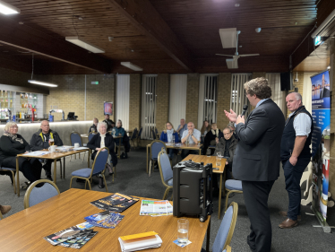 Joel speaking with residents, along with Andrew RT Davies MS, at the Fairwater Club in Cardiff