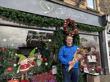 Joel standing outside the Flower Pot shop in Pontyclun