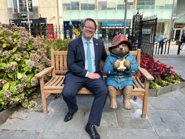 Joel James MS with Paddington Bear statue