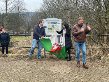 Joel James, Buffy Williams and Martin Roberts unveiling Rhondda Tunnel Society information board 