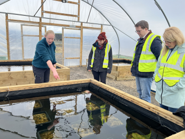 Joel James MS with Emily, Louise and Carly, looking at seagrass trials 