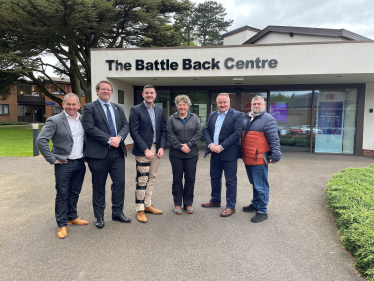 Joel James MS and Senedd Members outside the Battle Back Centre. 