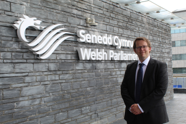 Joel James MS Outside Senedd. 